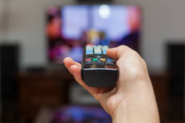 Using the remote control to change channels on Tv